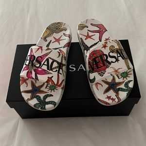 Versace pool slides - like new. Worn once. Size 38. Will fit 7-7.5. I’m a 7